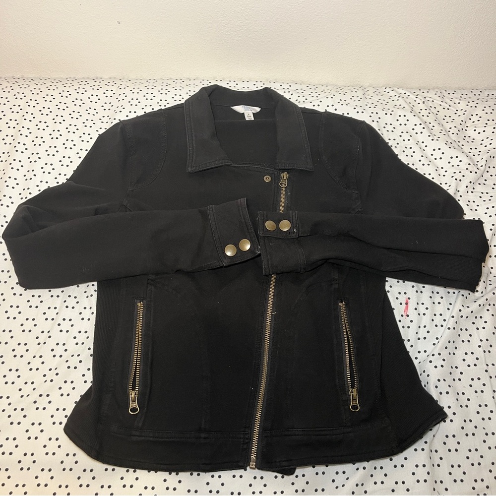 Black jacket with gold buttons and zippers.